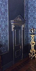 Emma Waddell of Doll House Designs, has painted P7 and used C14 as a doorcase surround to match the sumptuous dark blue wall paper.